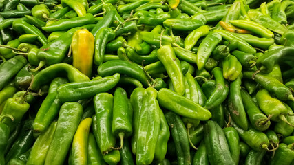 Detail of fresh green California or Anaheim chili peppers. Also called green chiles from the north...