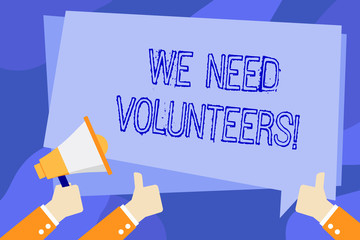 Writing note showing We Need Volunteers. Business concept for someone who does work without being paid for it Hand Holding Megaphone and Gesturing Thumbs Up Text Balloon