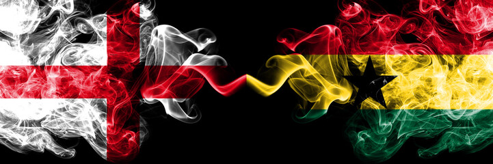 English vs Ghana, Ghanaian smoky mystic flags placed side by side. Thick colored silky smokes flag of England and Ghana, Ghanaian.
