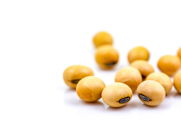 Pile of soy beans seeds isolated on white background. Selective focus. 