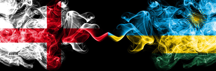 English vs Rwanda, Rwandan smoky mystic flags placed side by side. Thick colored silky smokes flag of England and Rwanda, Rwandan.