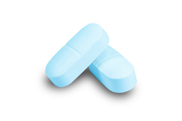 Closeup blue medicine pill isolated on white background.