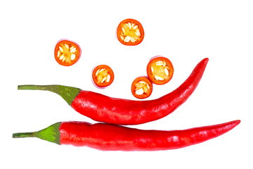 Closeup two red hot chill peppers with slices isolated on white background. Top view,Flat lay.