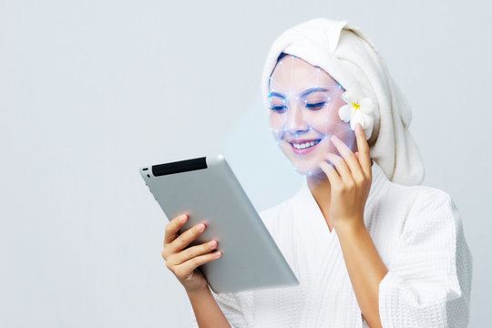 Technological scanning the face of Asian beautiful young woman for facial recognition and Analysis about skin care censor, Ensure personal safety and security in futuristic.