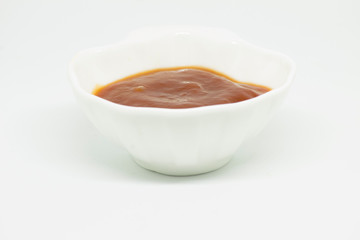  Ketchup in seashell on white background