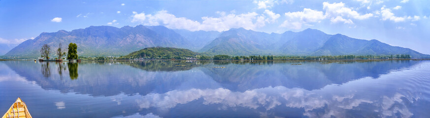 Mountain panorama of Dal Lake with the shore and a beautiful island in Kashmir