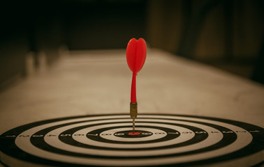 Red dart target arrow hitting on bullseye with,Target marketing and business success concept - Image