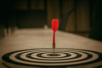 Red dart target arrow hitting on bullseye with,Target marketing and business success concept - Image