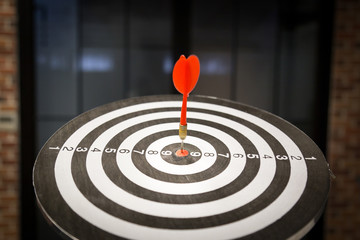 Fototapeta na wymiar Red dart target arrow hitting on bullseye with,Target marketing and business success concept - Image