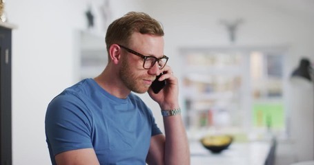 4K Casual business entrepreneur working on laptop at home & talking on phone - Powered by Adobe