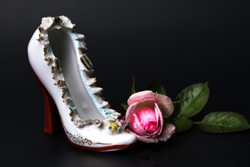 Vintage porcelain high heel shoe with wet pink rose