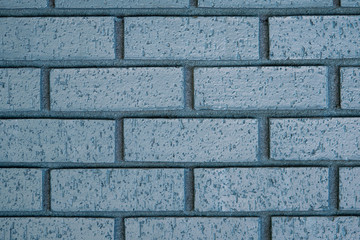 Blue outdoor  painted brick wall