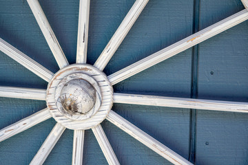 Old white wood wagon wheel decor © MikeFusaro