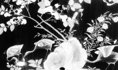 Bangkok, Thailand - May 19, 2019: The Tree and Flowers Art paintings isolated black and white on the tiles pattern wall along the galleries of the Temple of the Emerald Buddha, grand palace 