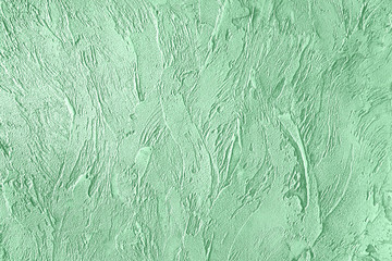 Trendy mint colored rouge concrete textured background for concept or product. Toned image.