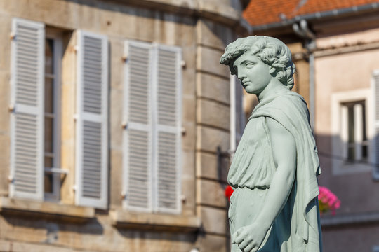 AVALLON / FRANCE - JULY 2015: Figure on the street of historic Avallon town, France
