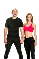 Portrait of confident athletic man and woman in sportswear with crossed hands