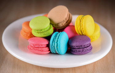 Colorful macaroons. Sweet macarons on dark background