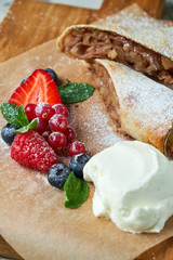 Apple strudel. Gray textured background. Beautiful serving dishes. Dessert. Food chain