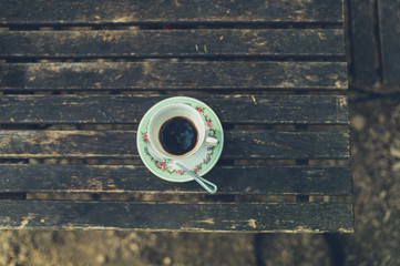 Cup of coffee on table outdoors