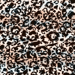 Seamless spotted leopard pattern. Brown, beige and blue ornament.