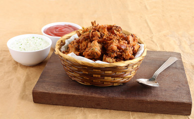 Pakoda, a traditional, popular, delicious, and an Indian vegetarian home-cooked snack, is made from deep-frying portions of split chickpea flour batter.