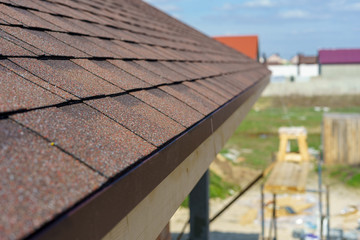 Asphalt tile roof on new home under construction