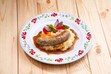sausage with mashed potato and vegetables