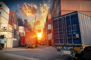Logistics and transportaIndustrial Container Cargo freight ship, forklift handling container box loading for logistic import export and transport industry concept backgroundtransport industry