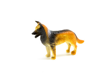 Toy plastic dog isolated on a white background