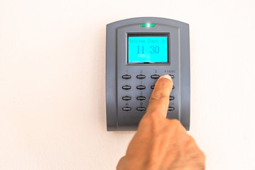 Man hand using security key card scanning to open the door to entering p home and building for security system