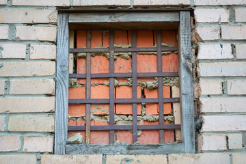 Brick-walled window opening.