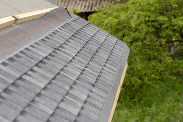 Asphalt tile roof on new house under construction