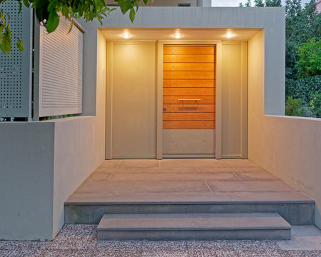 contemporary design apartment building entrance door, illuminated