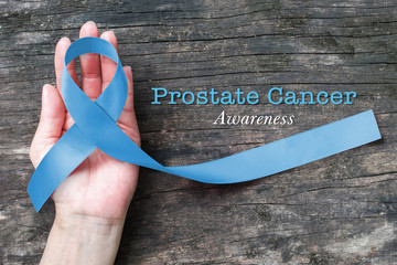 Blue ribbon symbolic of prostate cancer awareness campaign and men's health in November month on...