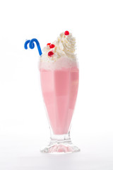 Strawberry pink milkshake with whipped cream and blue straw isolated on white background