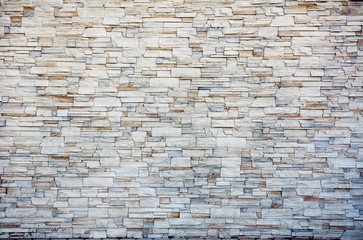 Grey and brown patterned wall of bricks