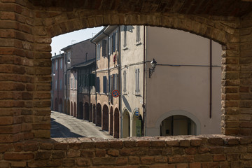 View from a Window in the Castle: Main Street, Colonnade and Houses in Fontanellato in Parma, Italy