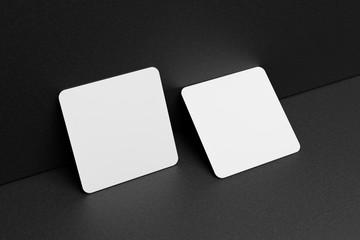 3D render Mock-up of the two square business cards are on a black paper