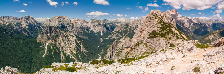 Fototapeta na wymiar Dolomites in sunny weather with puffy clouds