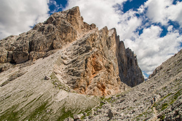 Dolomites in sunny weather with puffy clouds