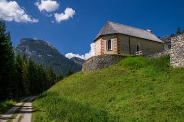 Fototapeta na wymiar Dolomites in sunny weather with puffy clouds