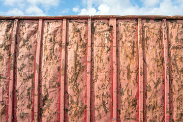 Rust spots on a steel container.