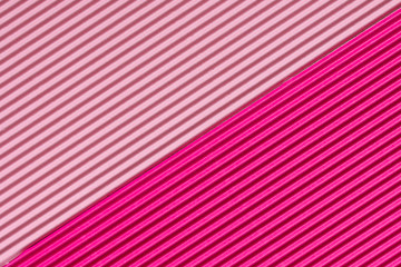 Abstract textured background created with striped details of pink corrugated cardboard