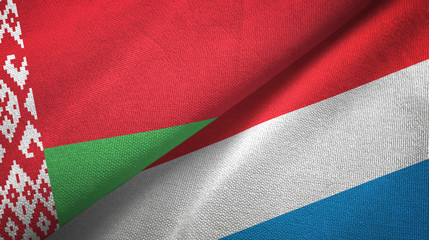 Belarus and Luxembourg two flags textile cloth, fabric texture