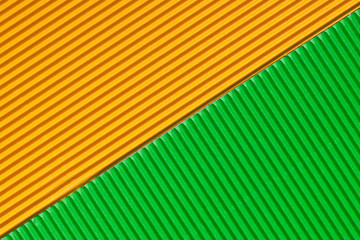 Abstract textured background created with striped details of yellow and green corrugated cardboard