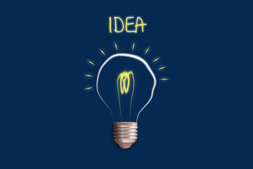 Concept Idea. Light bulb on a blue background. The concept of bright ideas for business, frequently asked questions, creative inspiration. Business. Creation.