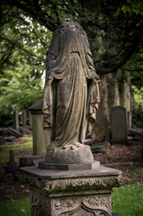 Fototapeta premium Memento mori statue on old graveyard in Edinburgh, Scotland