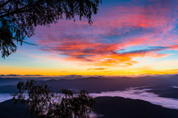 Fototapeta na wymiar Colourful First Sunrise view from a mountain