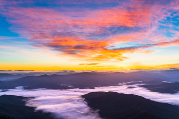 Fototapeta na wymiar Colourful First Sunrise view from a mountain